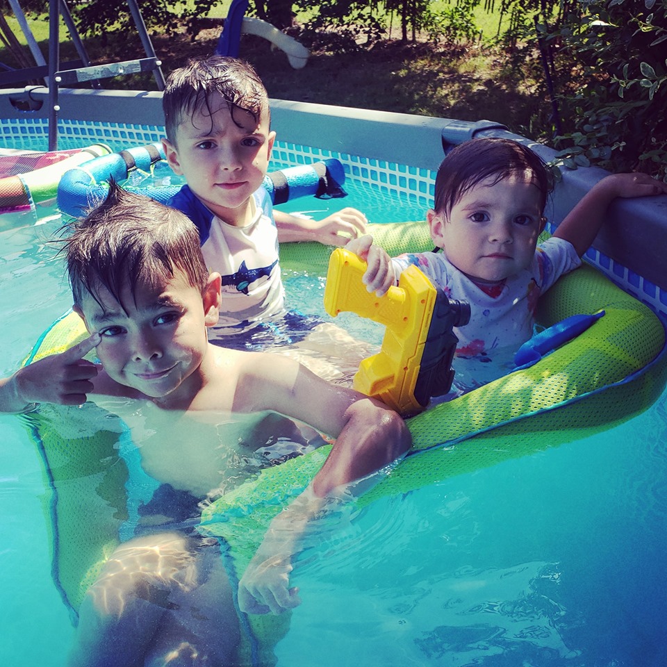 naomi clay's 3 tubal reversal babies on floaties in the pool