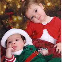 Tubal Reversal babies of Gilbert and Angela Merz dressed in christmas costumes