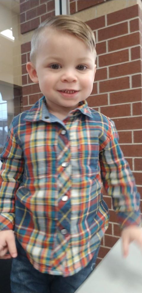 tubal reversal baby now a toddler wearing a plaid button up shirt