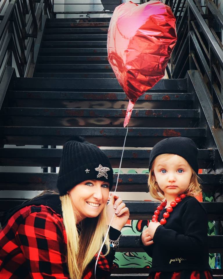 chas-plus-jes and her tubal reversal baby now toddler on valentines day with a heart-shaped balloon