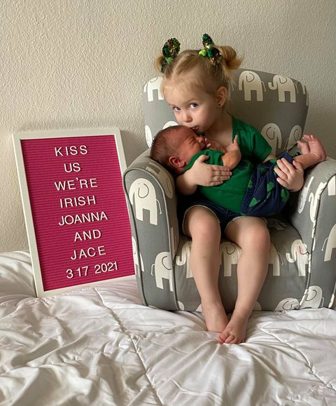 jamie jackson's first tubal reversal baby, now a toddler, kissing her baby brother, the second tubal reversal baby