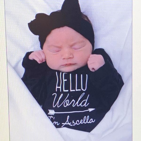 sara calderon's tubal reversal baby girl named ascella in a tshirt that says "hello world"