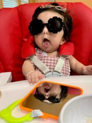 jenn pena's 6 month old baby she had after tubal reversal wearing funny black sunglasses