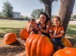 christie ann brown with her 2 tubal reversal babies in a pumpkin patch