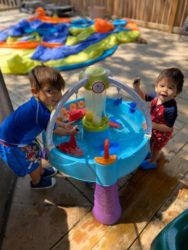 2 boys playing at a water table that were born after their mother had an essure reversal