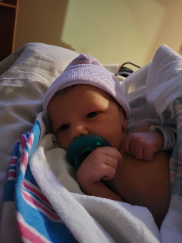 penton's newborn tubal reversal baby with pacifier