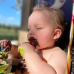 brandy arnold's tubal reversal baby eating chocolate cake for his first birthday