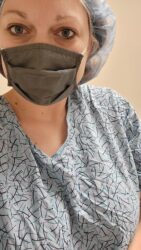 brandi boehm from enid oklahoma in a covid mask and surgical gown ready for her microsurgical tubal reversal procedure with doctor rosenfeld
