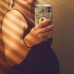 selfie of crystal cain pregnant with her first tubal reversal baby