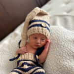 amanda c's newborn tubal reversal baby boy in a knit cap and trousers