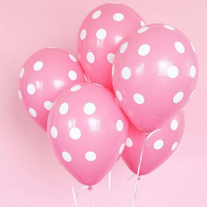 pink polka dot balloons celebrate the birth of a tubal reversal baby girl