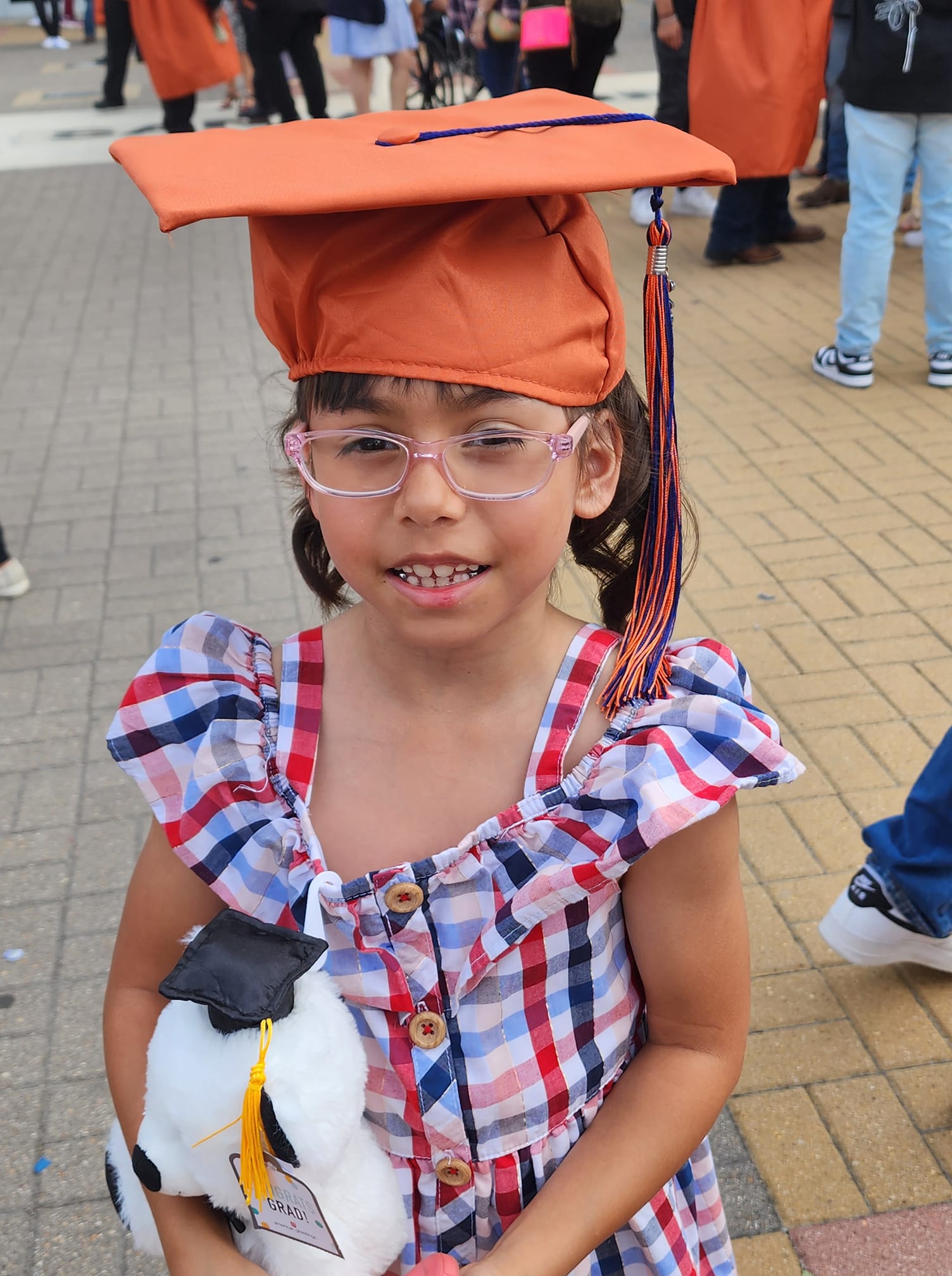 angela's 7-year-old tr baby girl in cap and gown